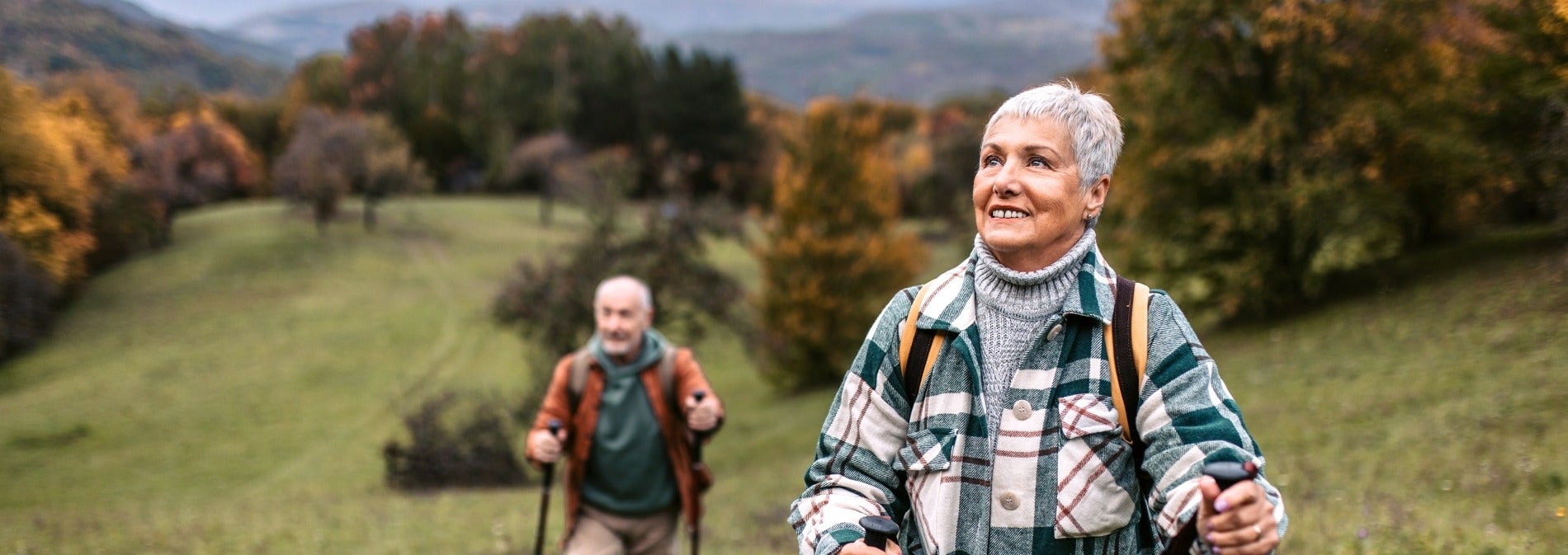 Older Couple Hiking a Hill
