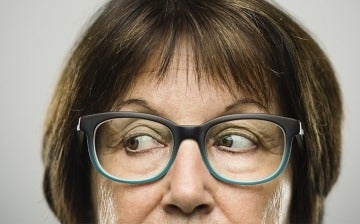 Close up of woman with glasses looking sideways