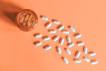 Pill bottle on orange background