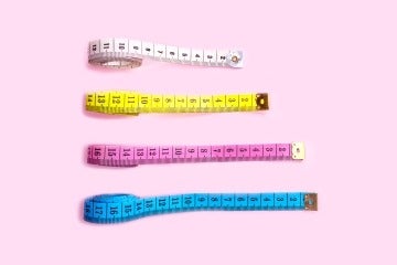 4 measuring tapes - one incrementally smaller than the next one.