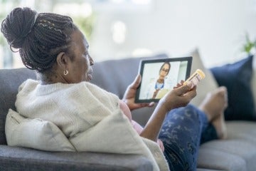 Woman having a telehealth appointment with her doctor