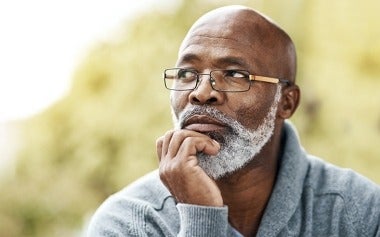 Close up of African American man looking depressed