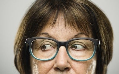Close up of woman with glasses looking sideways