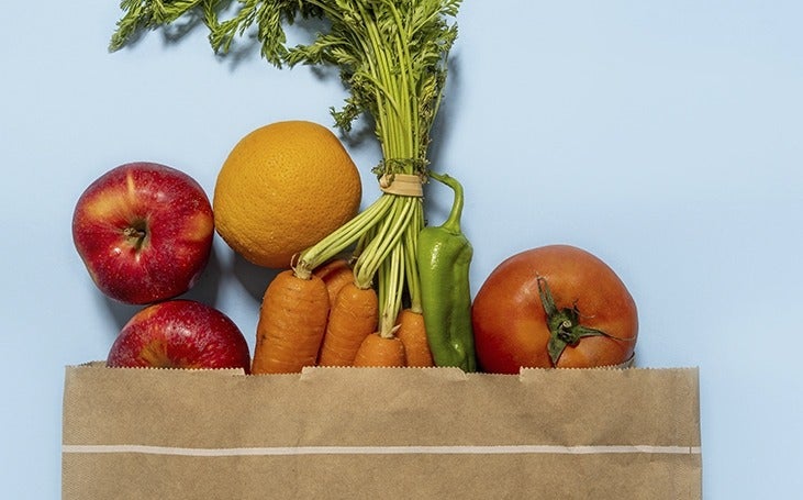 Close-up of a grocery bag of healthy vegtables