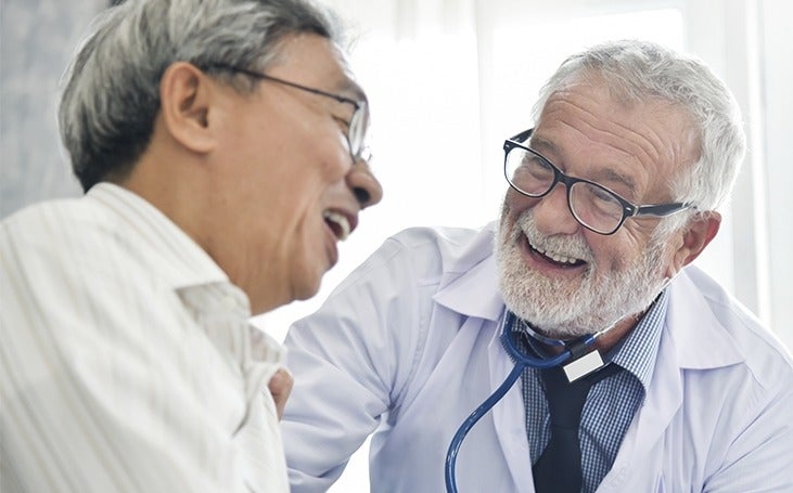 Doctor and male patient are talking in the medical room together